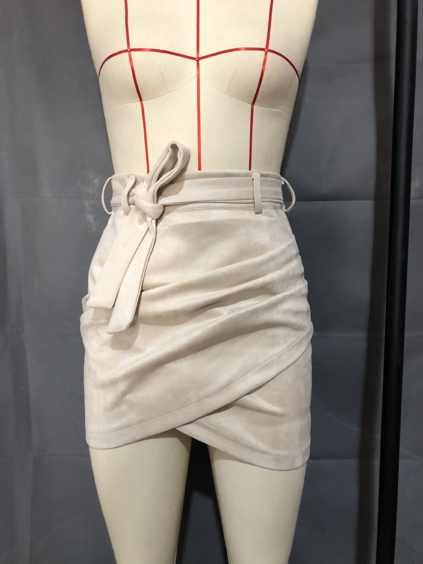 Irregular skirt with leather straps and hips