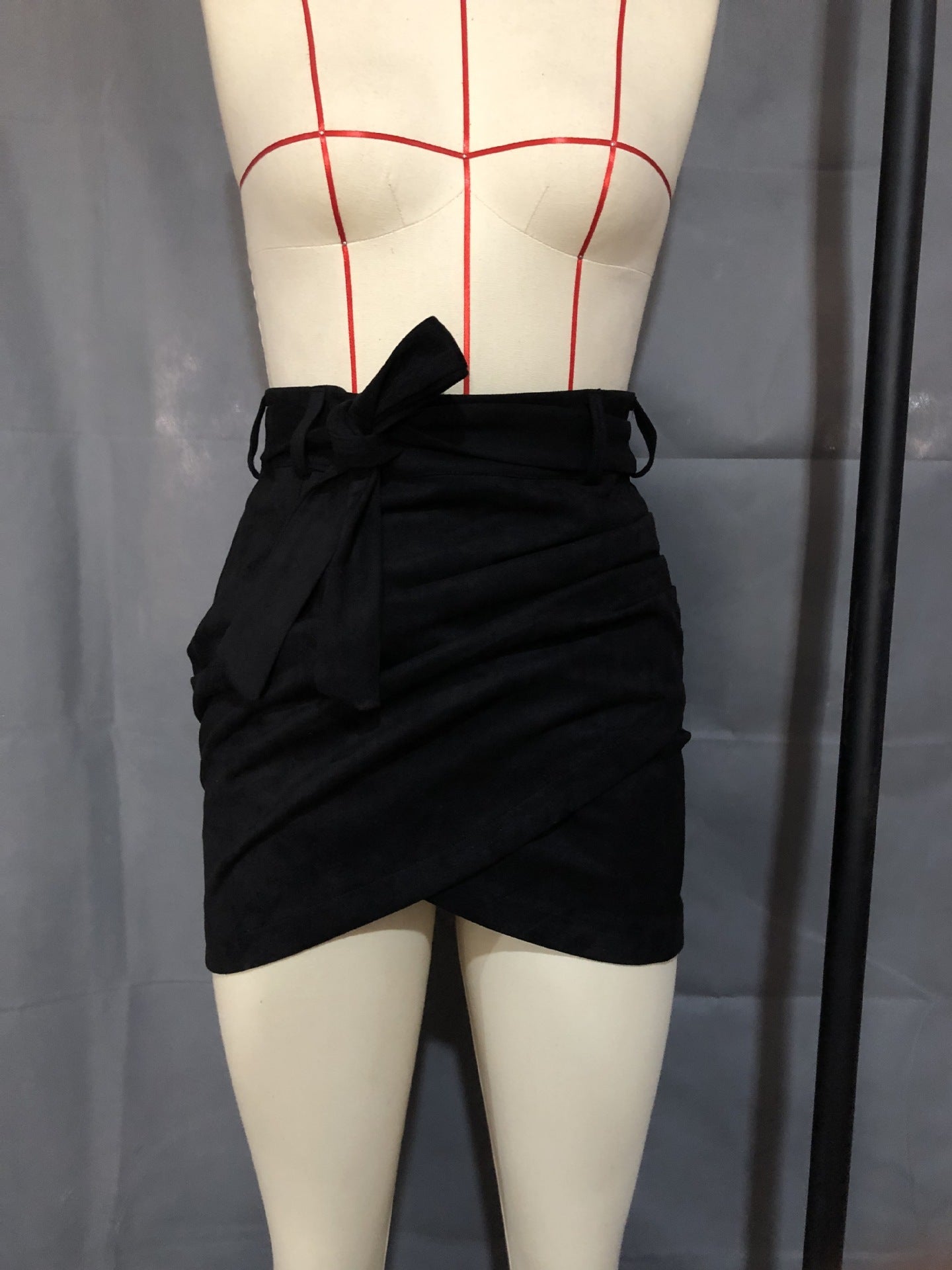 Irregular skirt with leather straps and hips